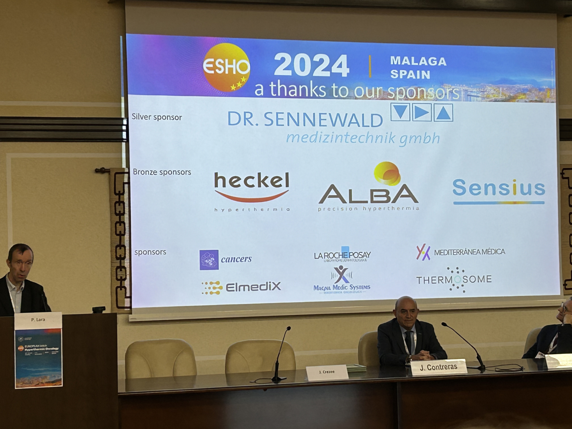 ESHO24 ESHO president Hans Crezee with a slide of the sponsors heckel news 2025 ESHO24 ESHO president Hans Crezee with a slide of the sponsors